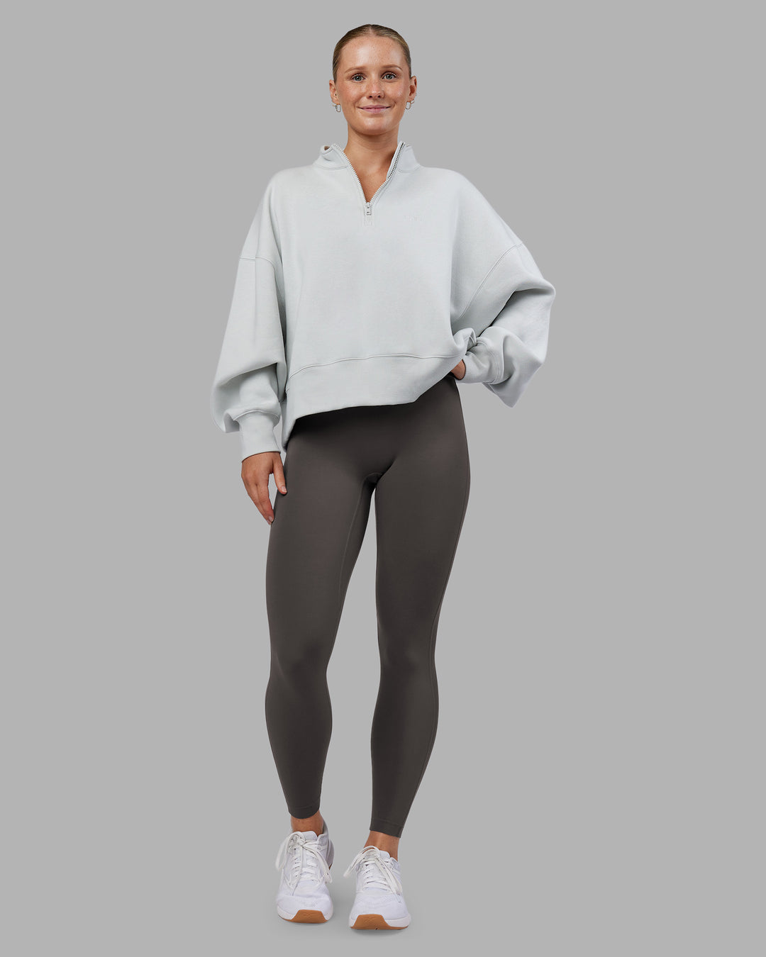 Woman wearing MVP 1/2 Zip Oversized Sweater - Digital Mist | Model:Neve | Size:S