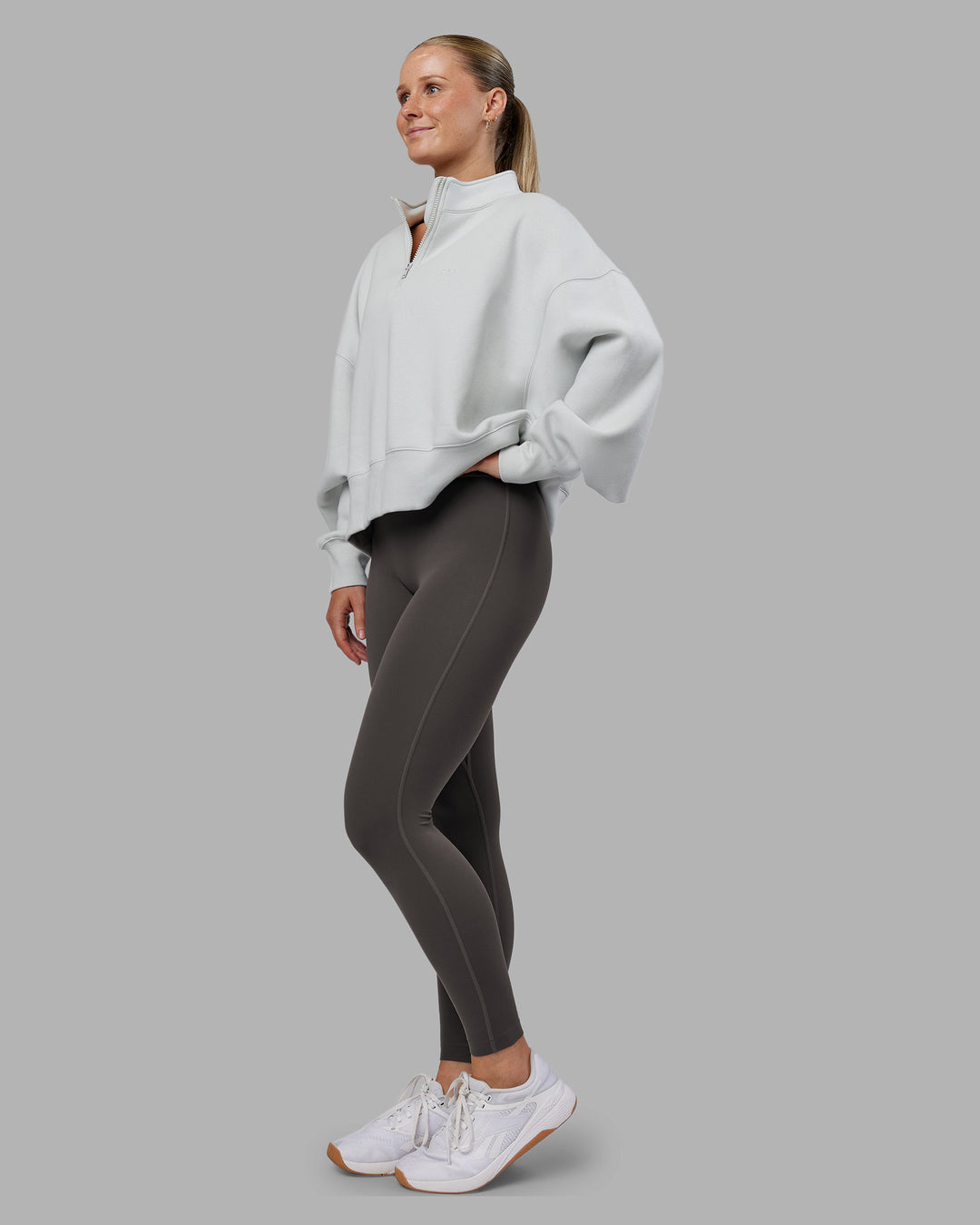 Woman wearing MVP 1/2 Zip Oversized Sweater - Digital Mist | Model:Neve | Size:S