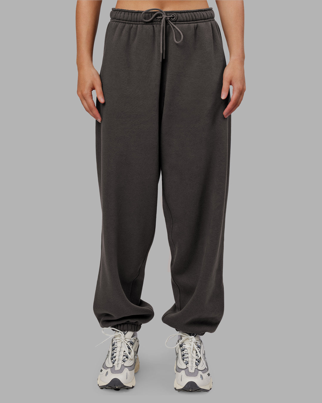 Woman wearing MVP Oversized Slouchy Fit Track Pant - Dark Storm | Model:Neve | Size:S