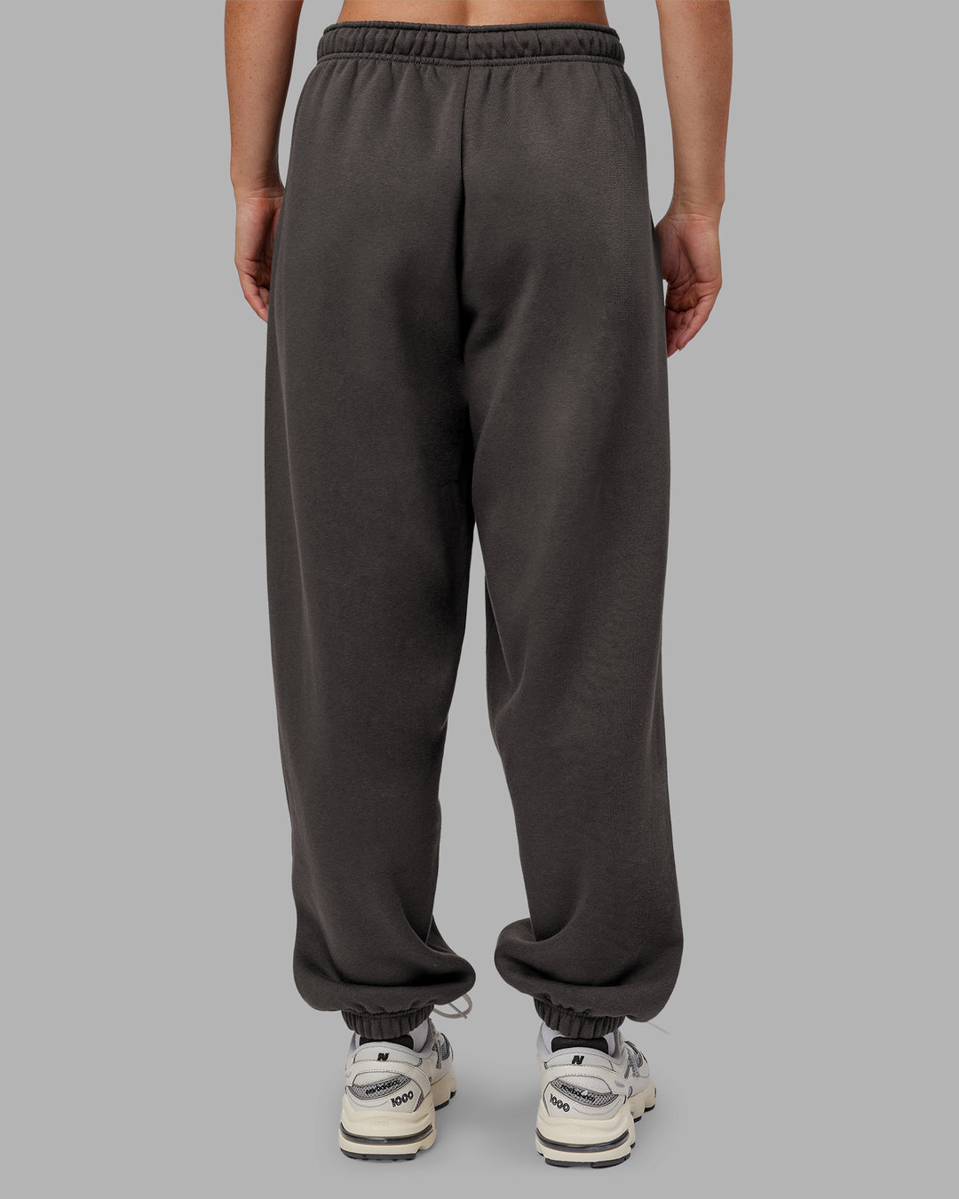 Woman wearing MVP Oversized Slouchy Fit Track Pant - Dark Storm | Model:Neve | Size:S