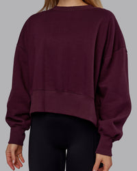 Woman wearing MVP Oversized Sweater - Cherry Lacquer | Model:Emilie | Size:S
