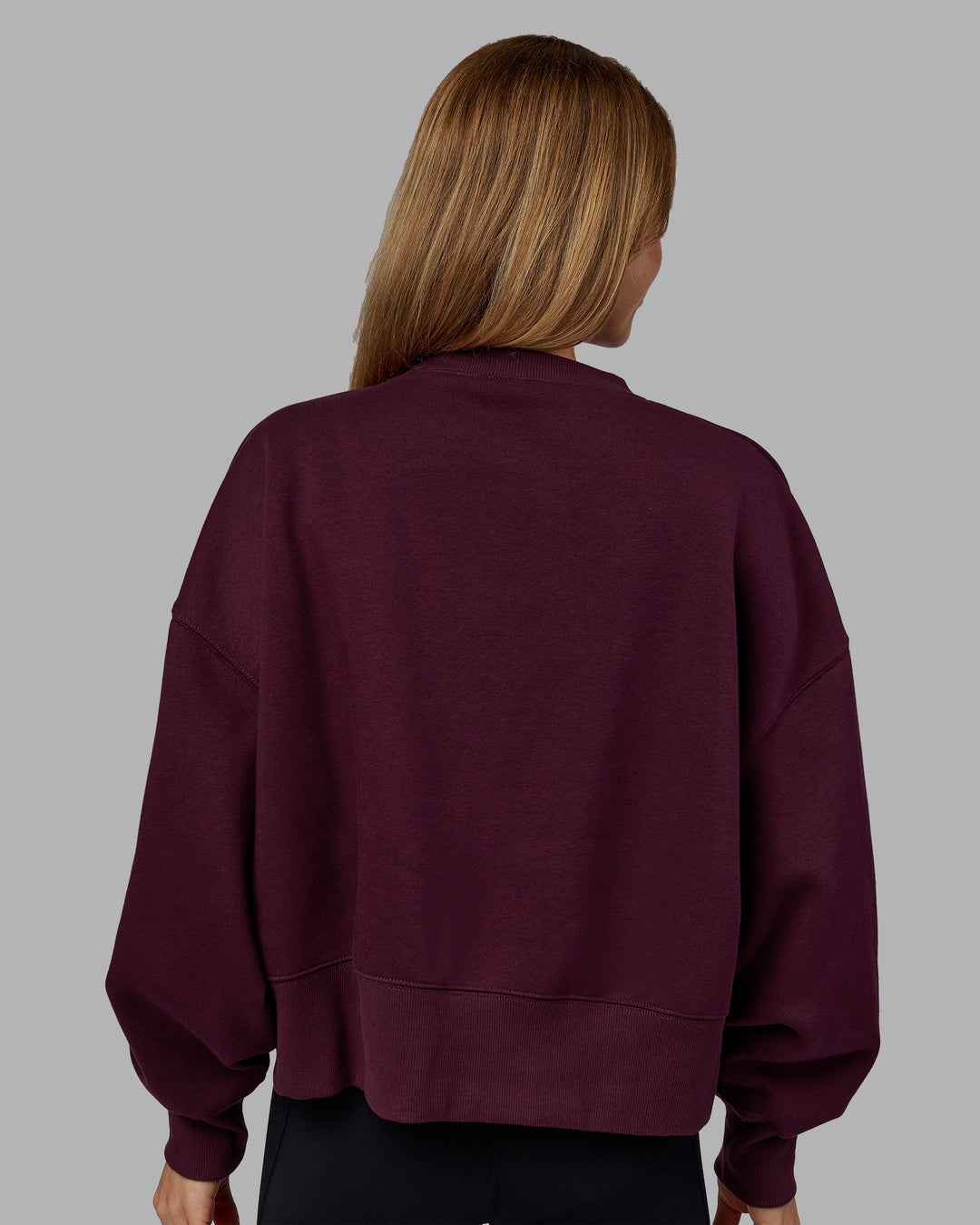 Woman wearing MVP Oversized Sweater - Cherry Lacquer | Model:Emilie | Size:S