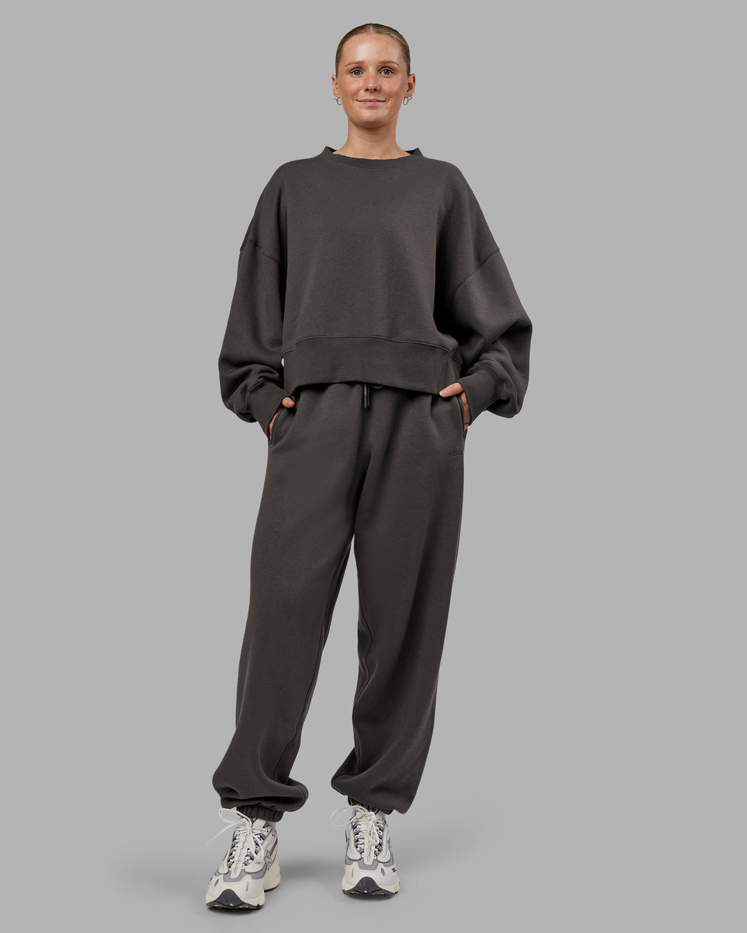 Woman wearing MVP Oversized Sweater - Dark Storm | Model:Neve | Size:S