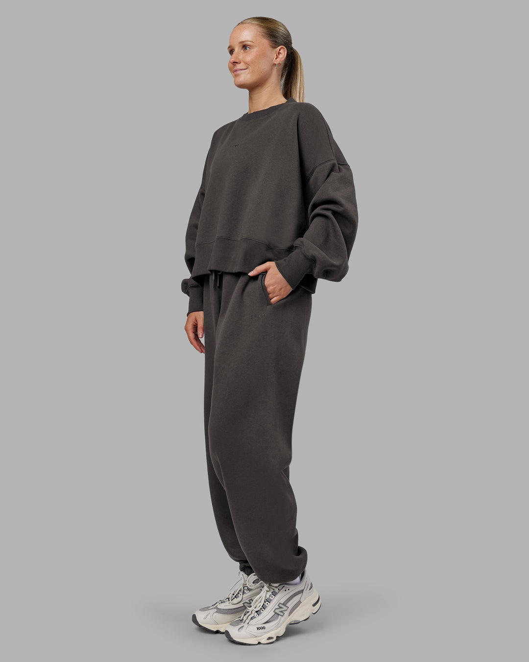 Woman wearing MVP Oversized Sweater - Dark Storm | Model:Neve | Size:S