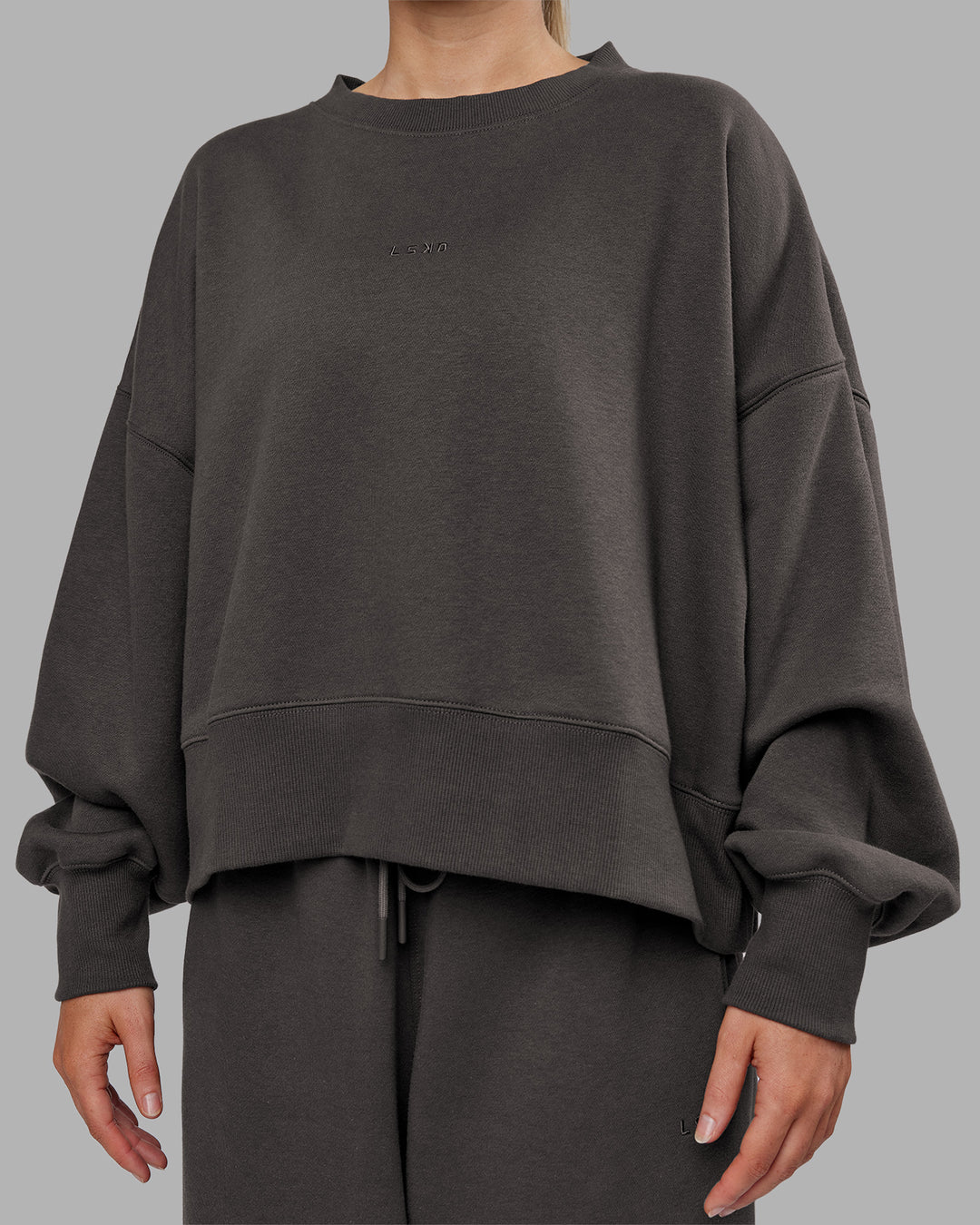Woman wearing MVP Oversized Sweater - Dark Storm | Model:Neve | Size:S