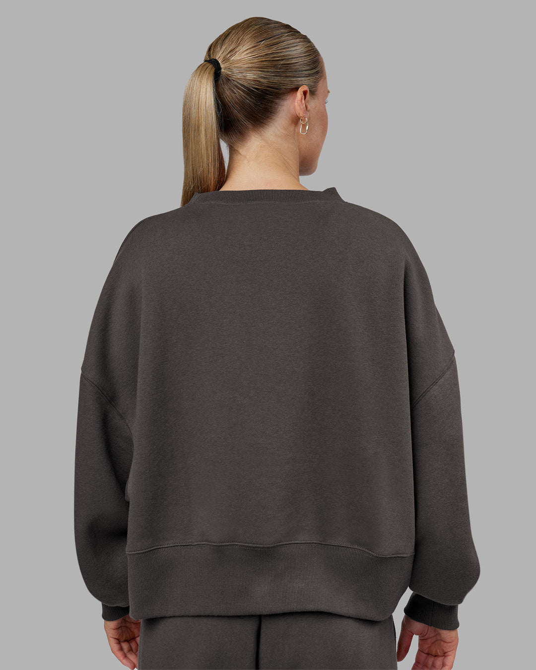 Woman wearing MVP Oversized Sweater - Dark Storm | Model:Neve | Size:S