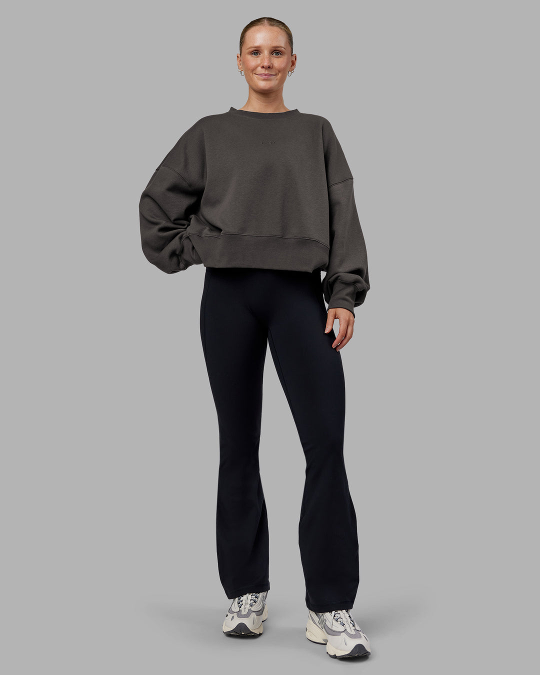 Woman wearing MVP Oversized Sweater - Dark Storm | Model:Neve | Size:S