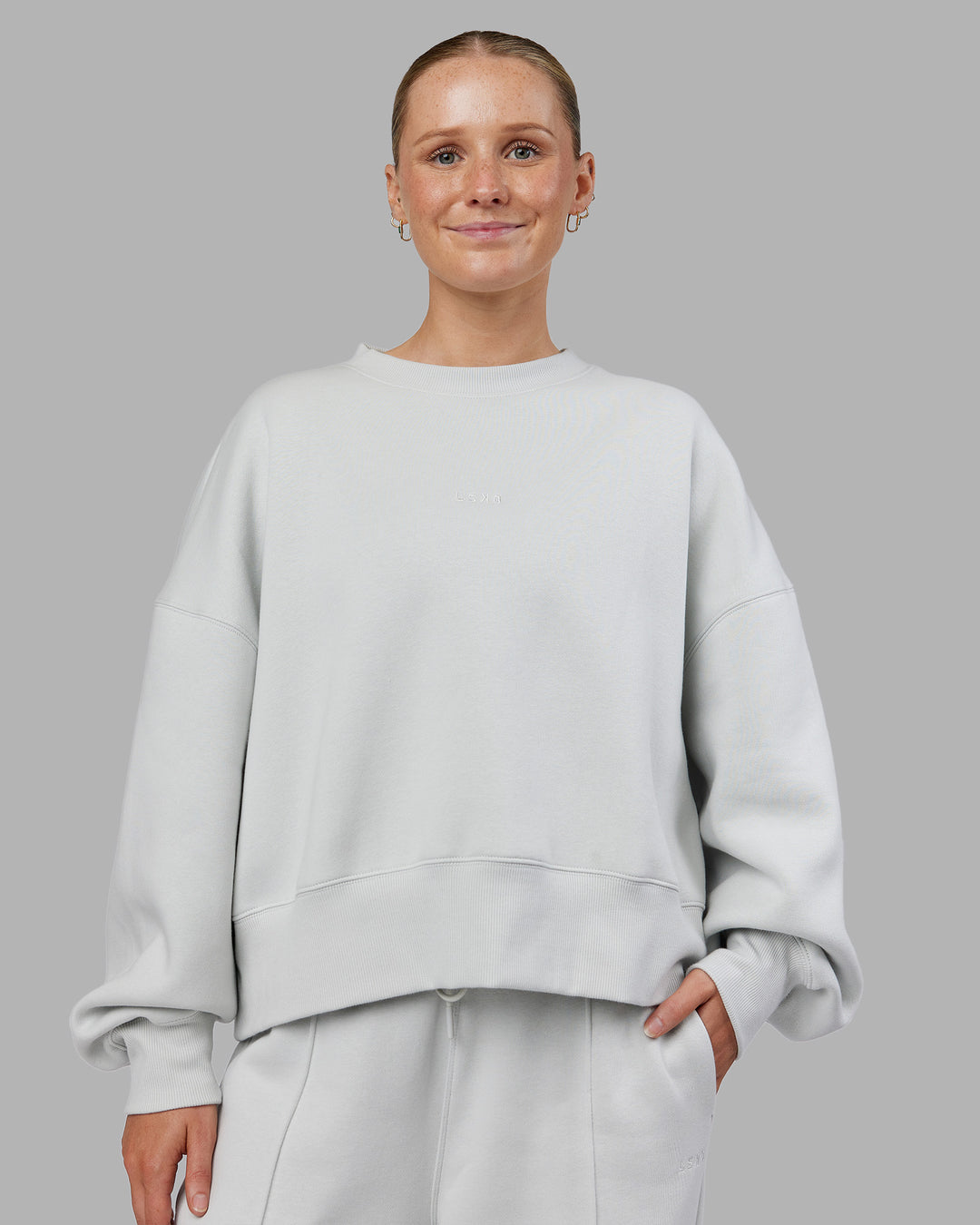 Woman wearing MVP Oversized Sweater - Digital Mist | Model:Neve | Size:S