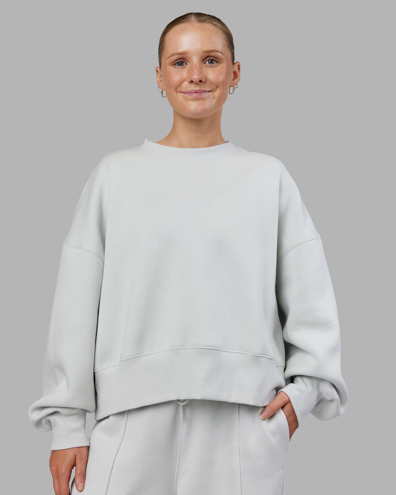 Woman wearing MVP Oversized Sweater - Digital Mist | Model:Neve | Size:S