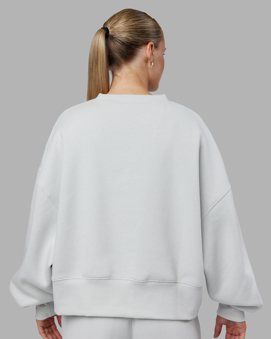 Woman wearing MVP Oversized Sweater - Digital Mist | Model:Neve | Size:S