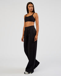 Woman wearing MVP Wide Leg Tall Track Pant - Black | Model:Ruby | Size:S