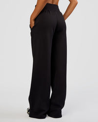 Woman wearing MVP Wide Leg Tall Track Pant - Black | Model:Ruby | Size:S