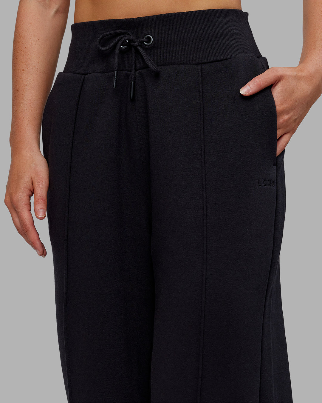 Woman wearing MVP Wide Leg Track Pant - Black | Model:Neve | Size:S