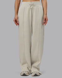 Woman wearing MVP Wide Leg Track Pant - Shale Beige | Model:Emilie | Size:S