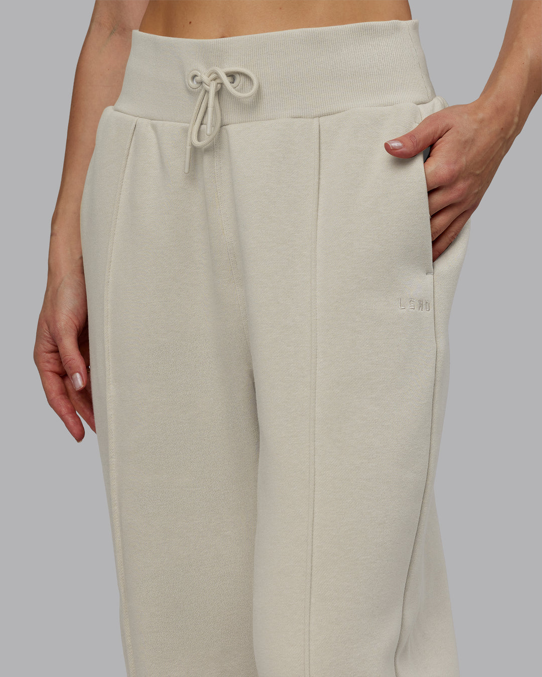 Woman wearing MVP Wide Leg Track Pant - Shale Beige | Model:Emilie | Size:S