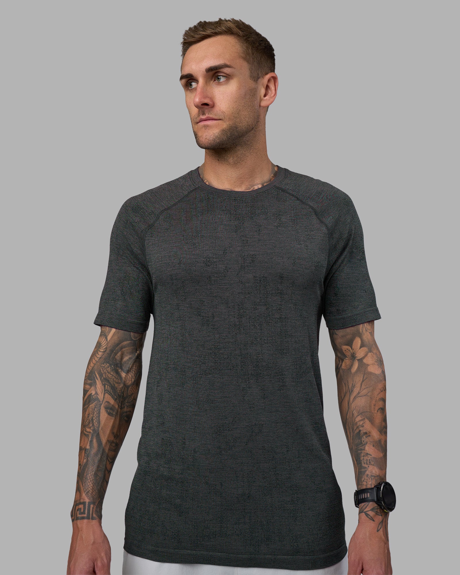 Man wearing AeroFLX+ Seamless Tee - Black Camo-Graphite | Model:Tommy | Size:L