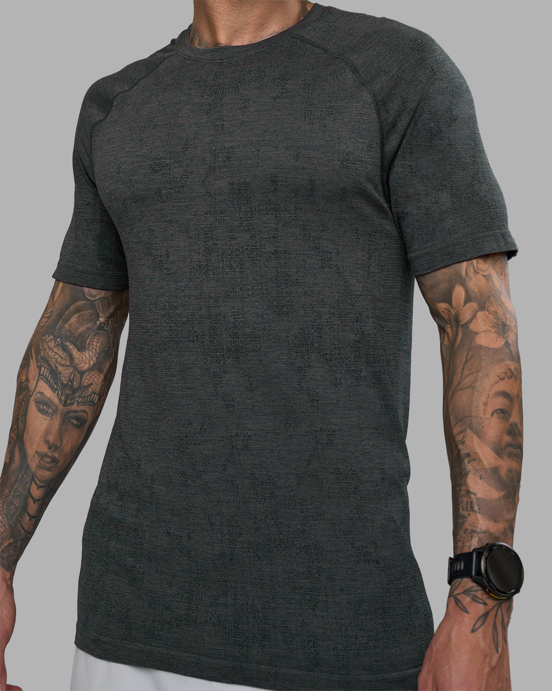 Man wearing AeroFLX+ Seamless Tee - Black Camo-Graphite | Model:Tommy | Size:L