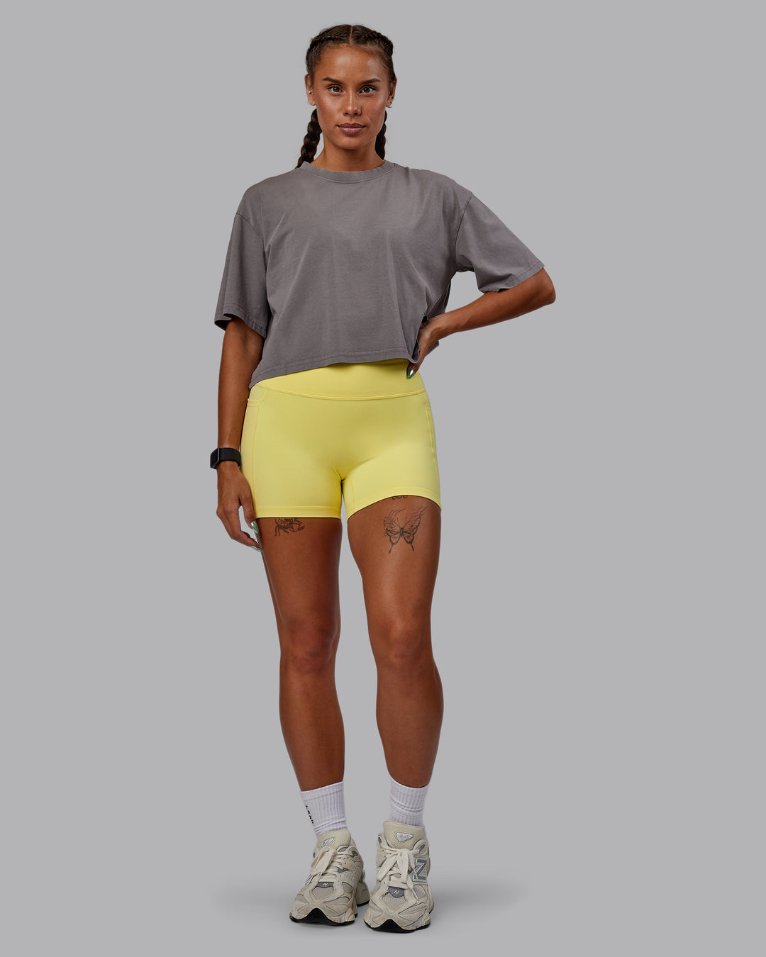 Woman wearing Miami 2025 FLXCotton Cropped Tee - Storm Front-Lemon Fizz