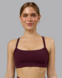Woman wearing Momentum Sports Bra - Cherry Lacquer | Model:Emilie | Size:S