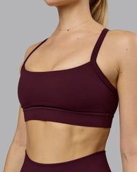 Woman wearing Momentum Sports Bra - Cherry Lacquer | Model:Emilie | Size:S