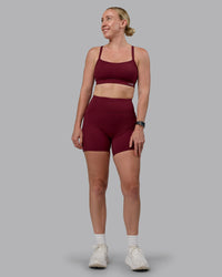 Woman wearing Momentum Sports Bra (D/DD/E) - Cordovan