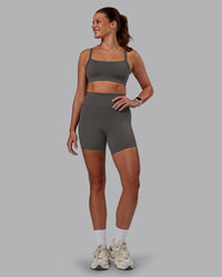 Woman wearing Momentum Sports Bra - Dark Storm | Model:Phoebe | Size:S