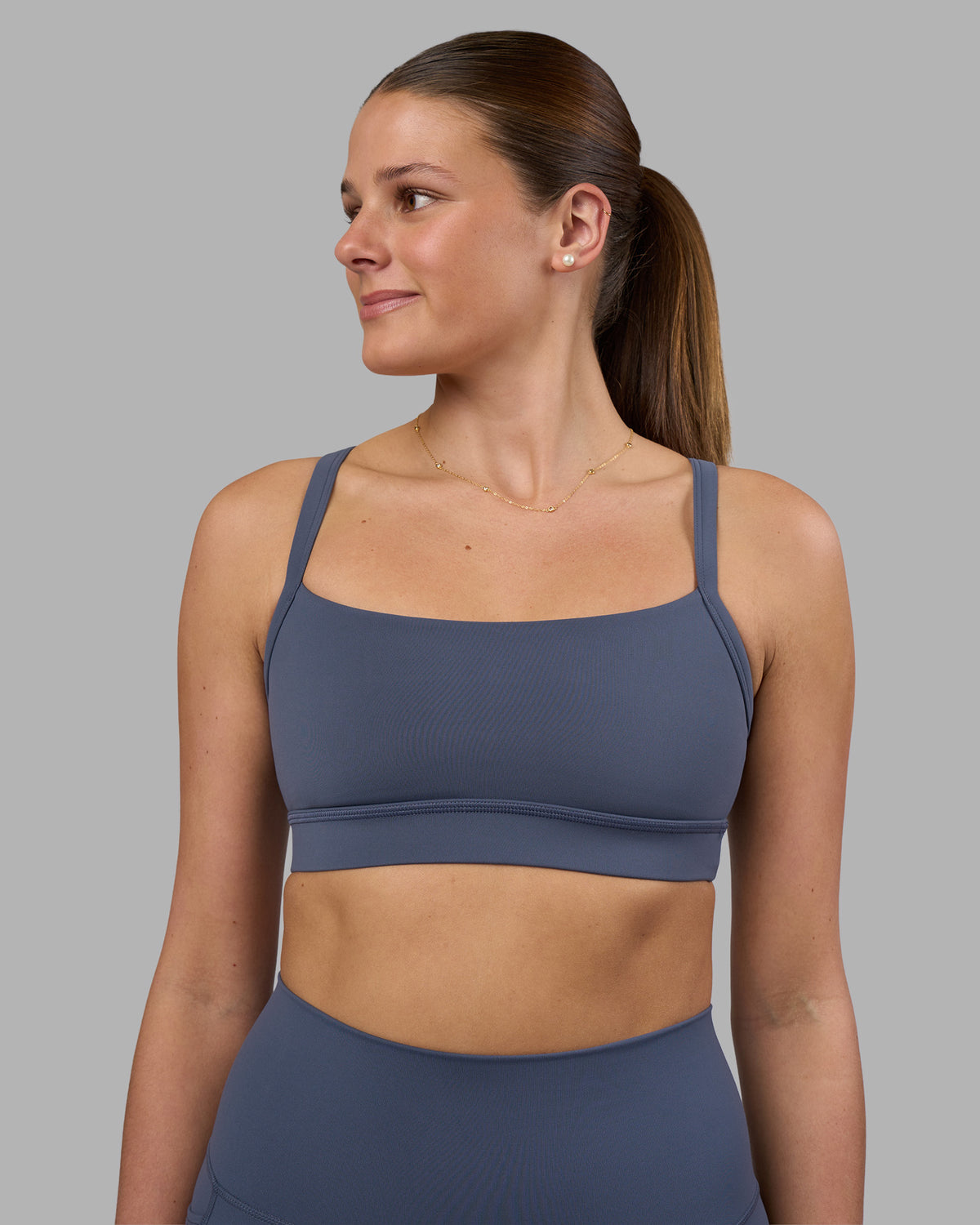 Woman wearing Momentum Sports Bra - Night Shadow | Model:Phoebe | Size:S
