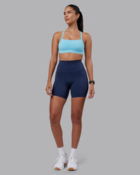 Woman wearing Momentum Sports Bra - Sky Blue | Model:Rhiley | Size:S