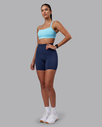 Woman wearing Momentum Sports Bra - Sky Blue | Model:Rhiley | Size:S