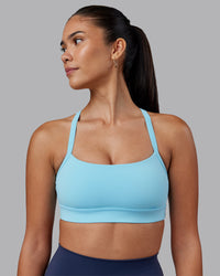 Woman wearing Momentum Sports Bra - Sky Blue | Model:Rhiley | Size:S