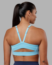 Woman wearing Momentum Sports Bra - Sky Blue | Model:Rhiley | Size:S