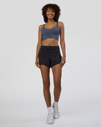 Woman wearing Movement CloudFLX 3" Short - Black | Model:Tomi | Size:S