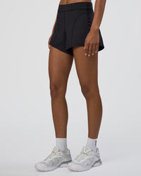 Woman wearing Movement CloudFLX 3" Short - Black | Model:Tomi | Size:S