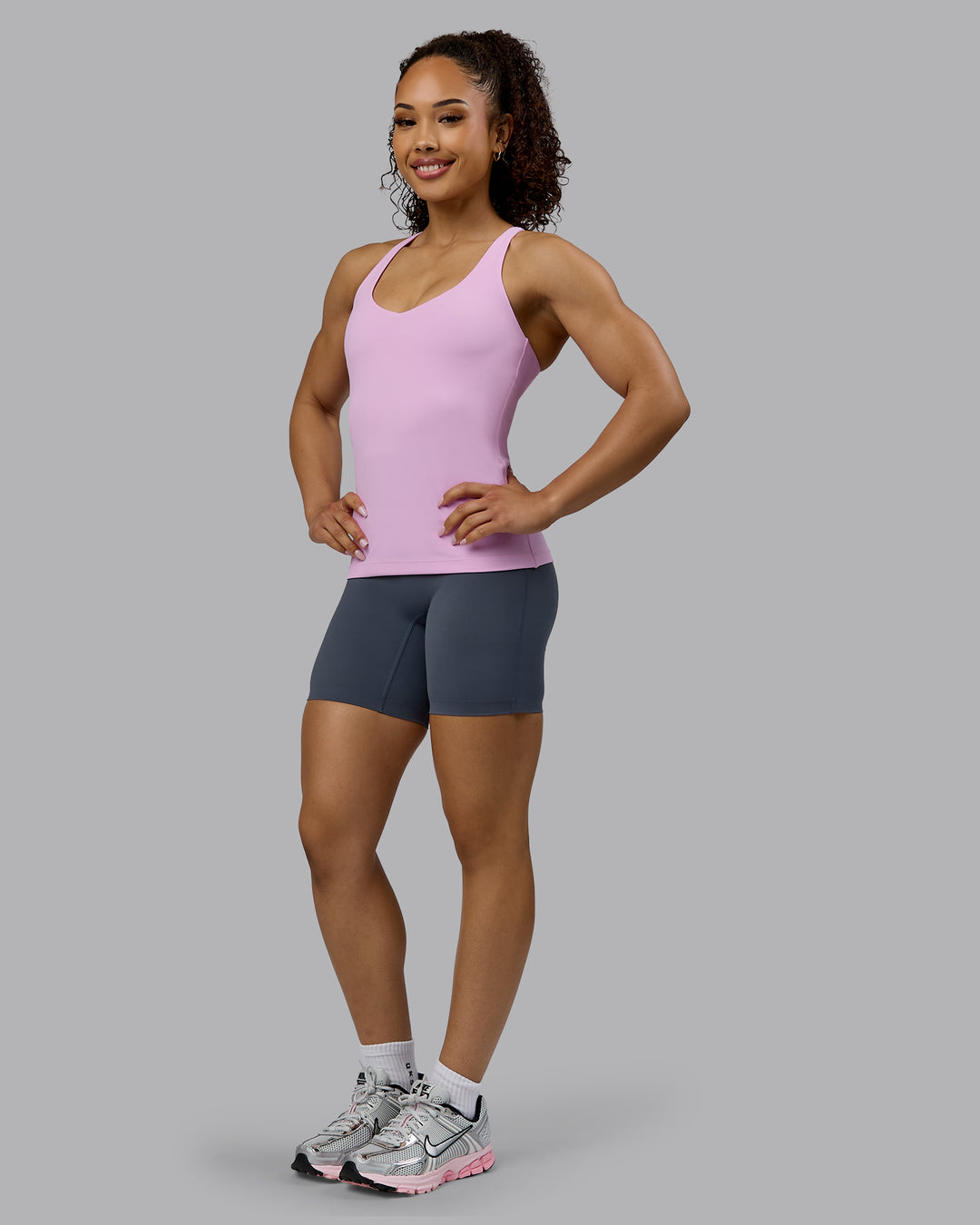Woman wearing Movement Longline Active Shelf Bra Tank - Pastel Orchid