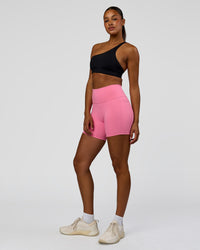 Woman wearing Muse Asymmetric Sports bra - Black | Model:Rosie | Size:S