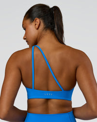 Woman wearing Muse Asymmetric Sports bra - Palace Blue | Model:Rosie | Size:S | Thumbnail Index: 6