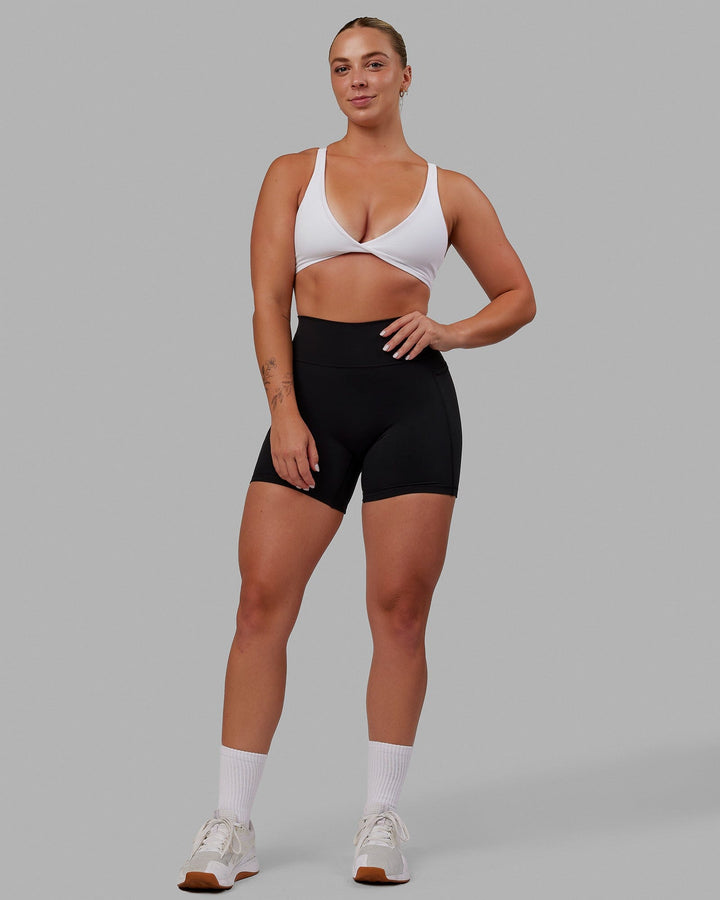 Woman wearing Nimble Sports Bra - White