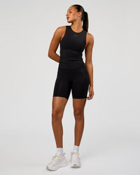 Woman wearing NyxRun Stash Tank - Black | Model:Rosie | Size:S
