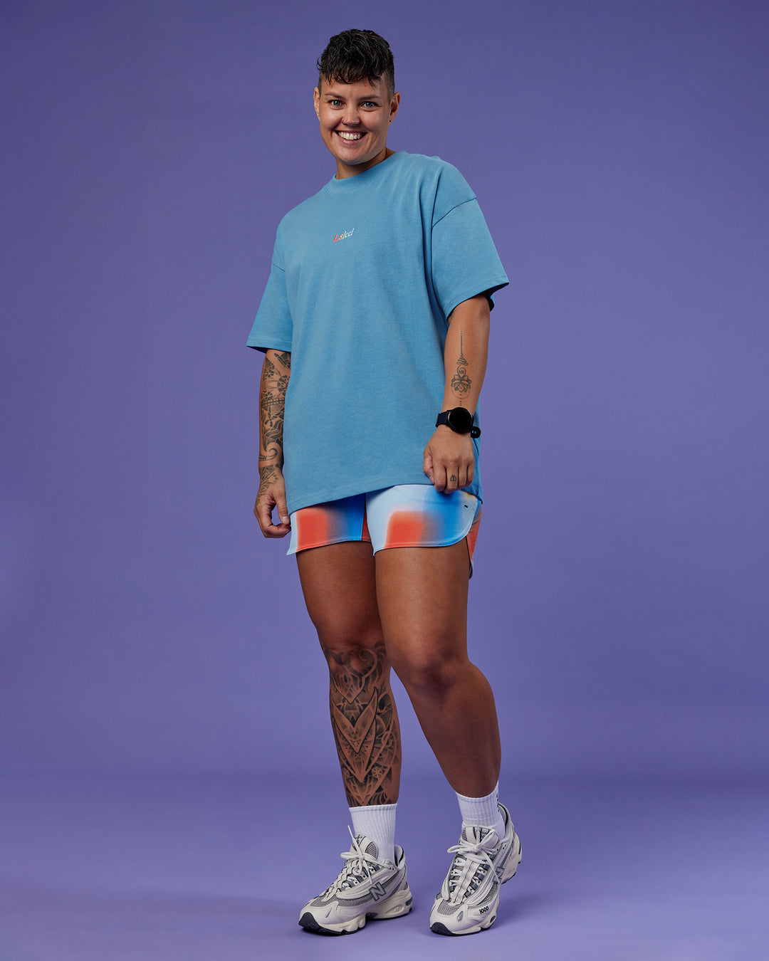 Model wearing Our Journey Heavyweight Oversized Tee - Azure Blue-Rainbow | Model:Em | Size:S