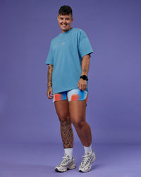 Model wearing Our Journey Heavyweight Oversized Tee - Azure Blue-Rainbow | Model:Em | Size:S