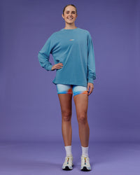 Woman wearing Our Journey Oversize Heavyweight FLXCotton Long Sleeve Tee - Azure Blue | Model:Mon | Size:S