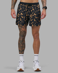 Man wearing Pace 5" Lined Running Short - Markings Black Print | Model:Tommy | Size:S