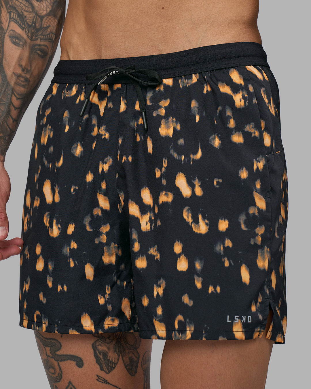 Man wearing Pace 5" Lined Running Short - Markings Black Print | Model:Tommy | Size:S