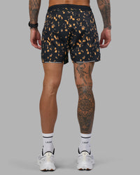 Man wearing Pace 5" Lined Running Short - Markings Black Print | Model:Tommy | Size:S
