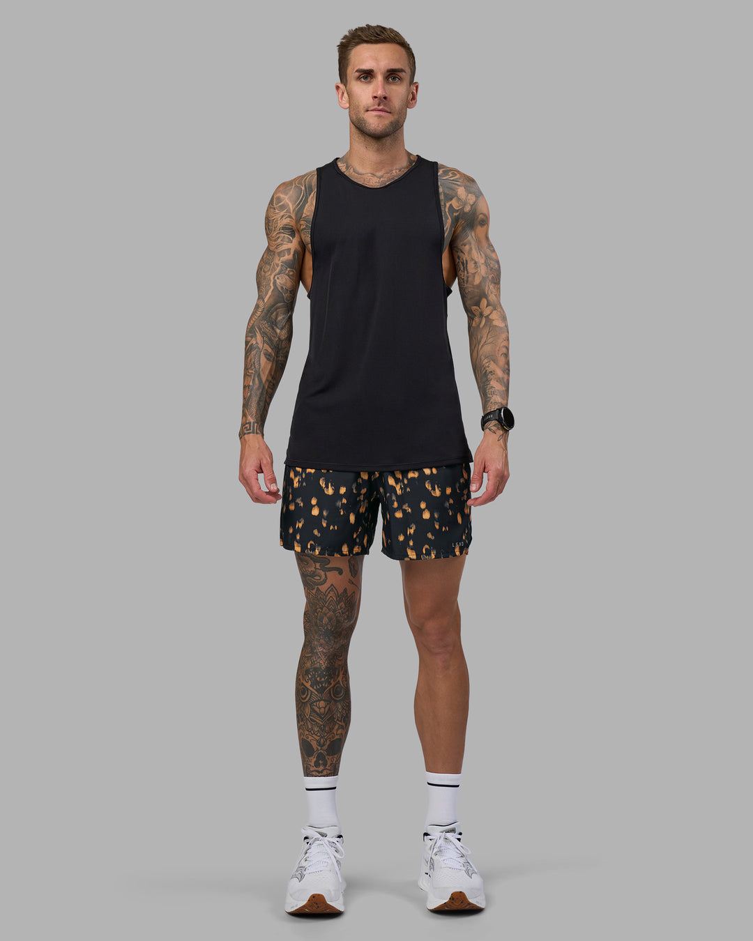 Man wearing Pace 5" Lined Running Short - Markings Black Print | Model:Tommy | Size:S