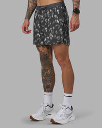 Man wearing Pace 5" Lined Running Short - Markings Dark Storm Print | Model:Tommy | Size:S