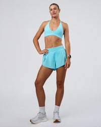 Woman wearing Pacer 3" Run Short - Baltic Sea | Model:Emelia | Size:S