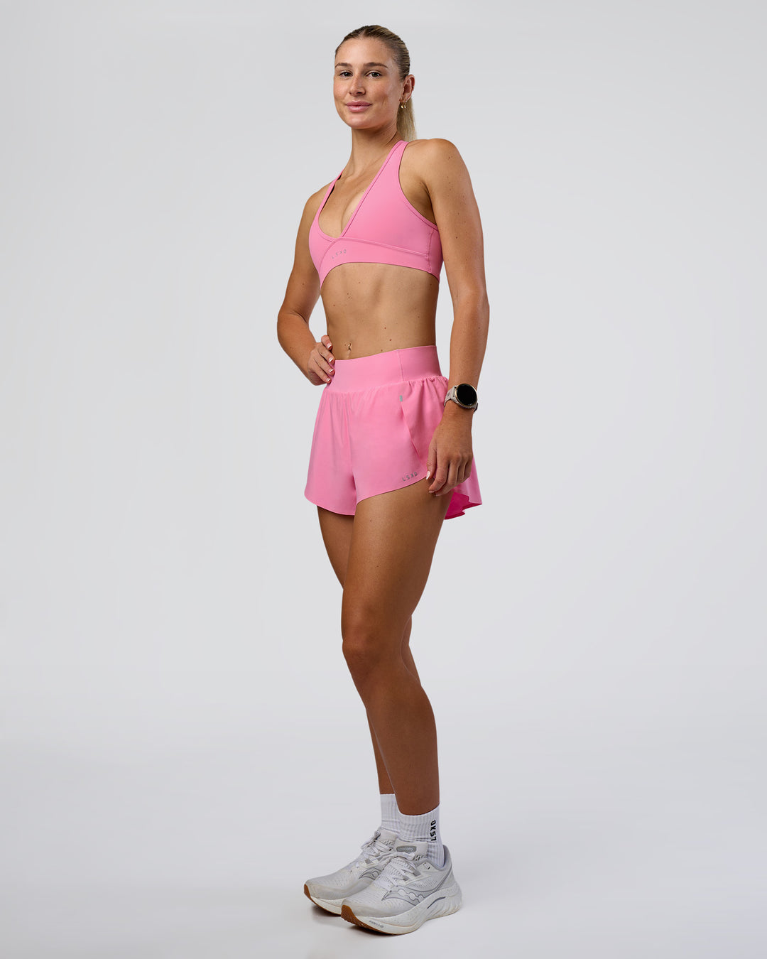 Woman wearing Pacer 3" Run Short - Candy Pink | Model:Emelia | Size:S