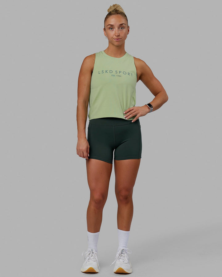 Woman wearing Penalty Tank - Green Fig-Storm