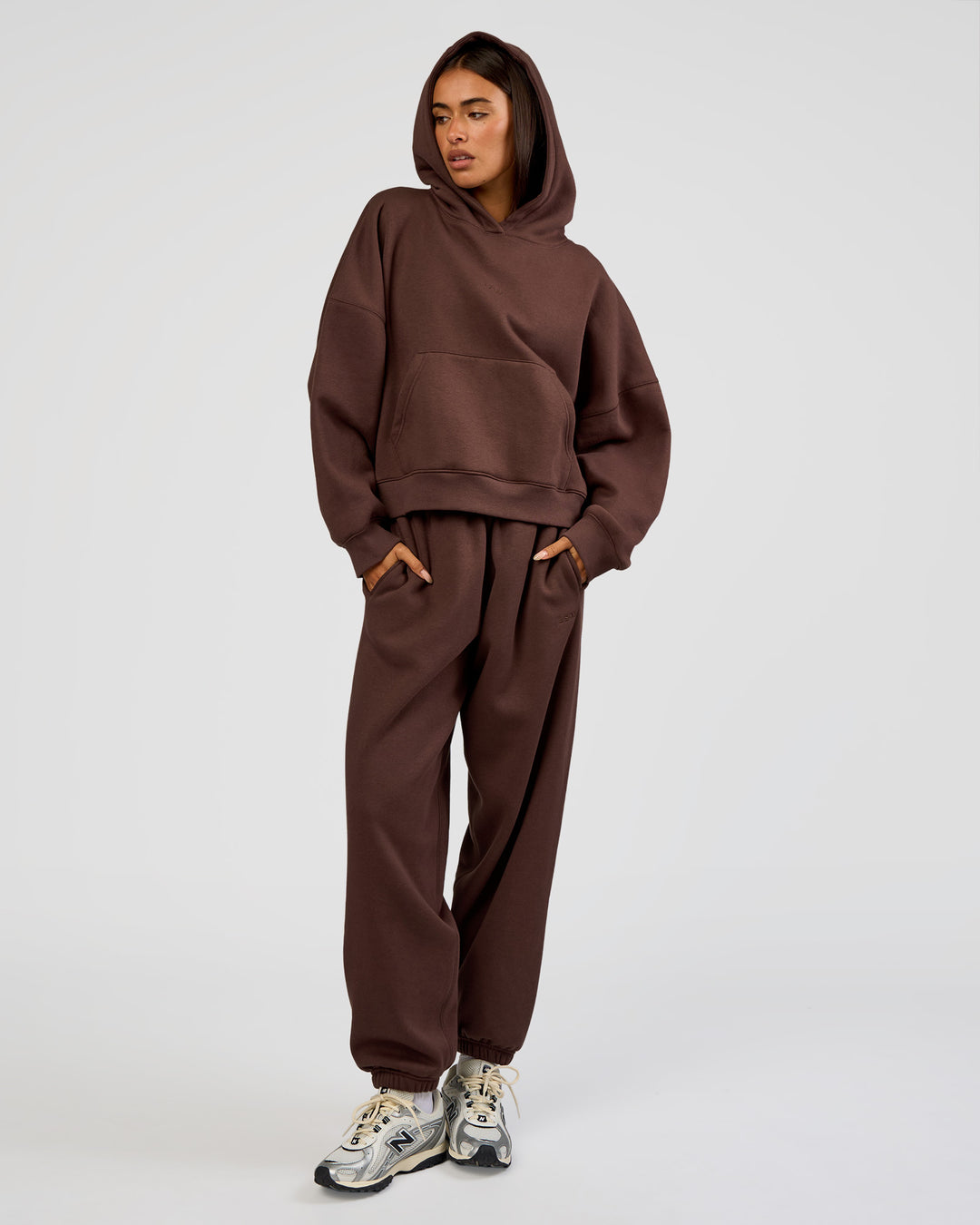 Woman wearing Post Train Hoodie - Hot Chocolate | Model:Ruby | Size:S